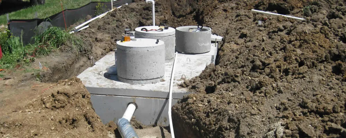 Septic system repair and installation site with tank access ports in Raleigh, NC